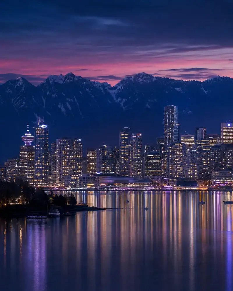 Vancouver skyline, mountains, and waterfront at night